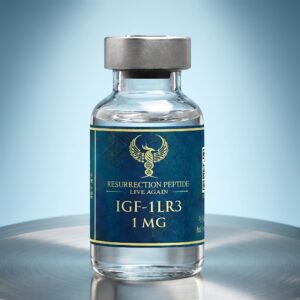 A high-resolution studio photograph of a clear glass vial containing Resurrection Peptide IGF-1LR3 1 MG. The vial, featuring a premium dark teal and gold label, rests on a circular brushed metal surface against a smooth blue gradient background.