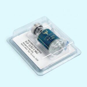 An angled, top-down view of a single Resurrection Peptide IGF-1LR3 1 MG vial securely sealed in a clear plastic blister pack. The white backing card clearly displays the brand name, batch number, expiration date, and a "Research Use Only" disclaimer.
