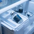 A frosted glass vial of MOTS-C 40MG from Resurrection Peptide stored inside a laboratory refrigerator to maintain peptide stability and bioactivity for scientific research.