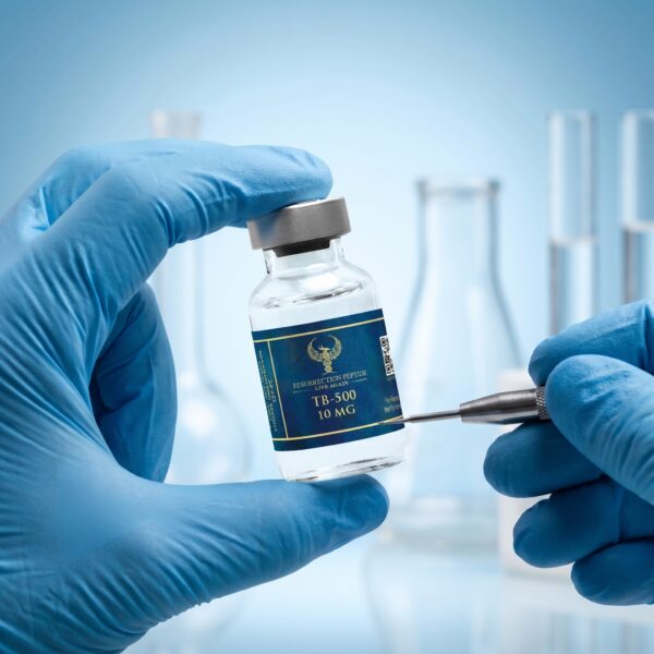 A close-up of a scientist's hand wearing a blue nitrile glove holding a Tirzepatide 10MG vial by Resurrection Peptide, with out-of-focus scientific glassware in the blue clinical background.